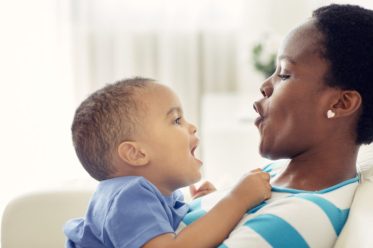 Mother And Her Little Boy Having Fun.