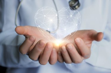 Heart in the hands of the doctor.